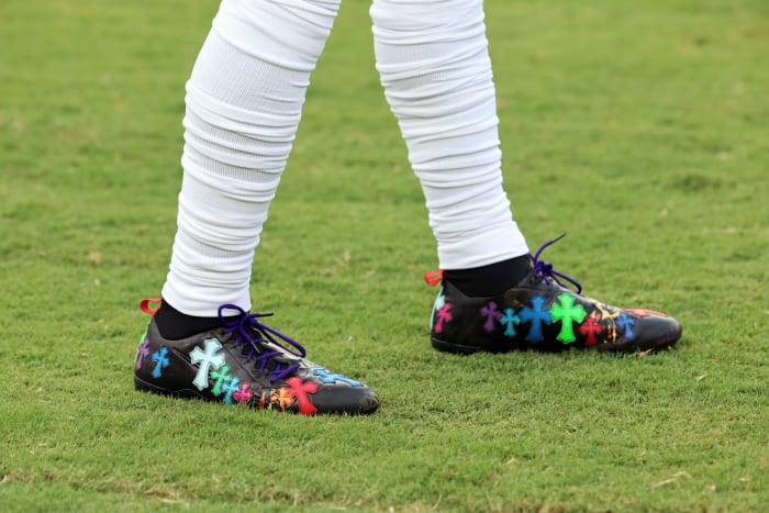 Side view of Odell Beckham Jr.'s black, blue, and green cleats.